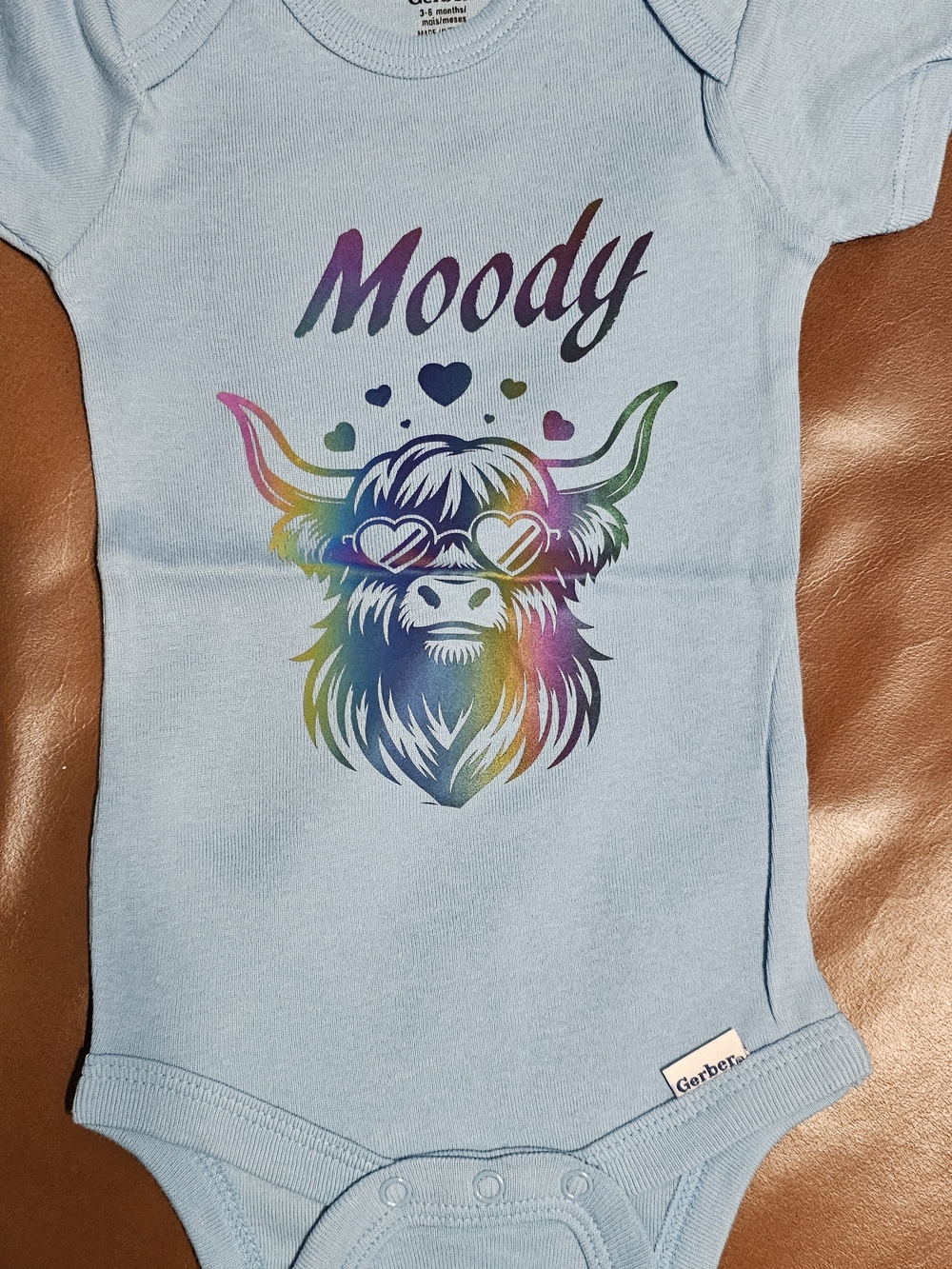 Gerber Light Blue Baby Onesie with Rainbow Highland Cow Graphic